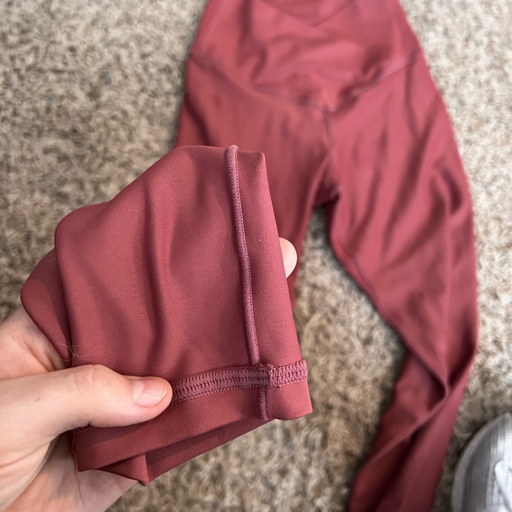 NEW NEVER WORN LEGGINGS! By Pink Lily!! Size Small! And its a dark pink color!!